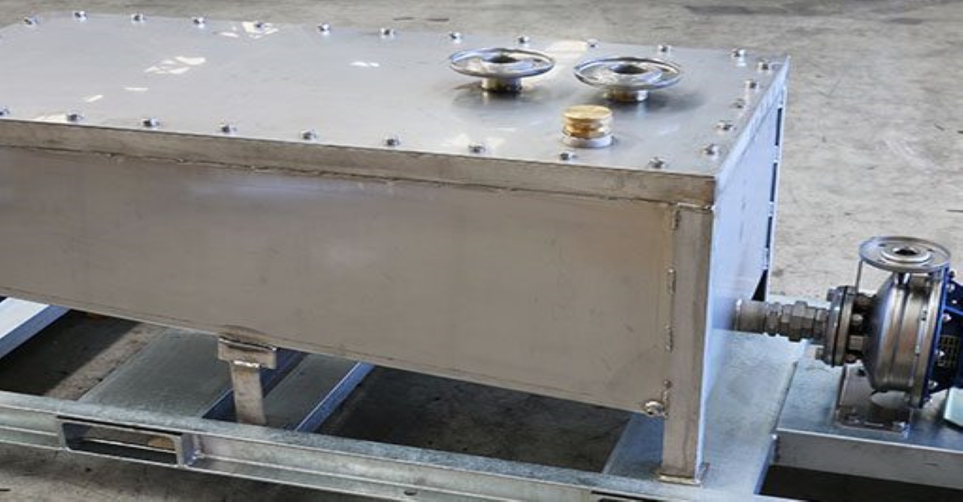 Stainless steel boiler blowdown tank skid system coupled with an Ebara centrifugal pump, engineered for safely cooling and controlling high-pressure water discharge in steam system applications