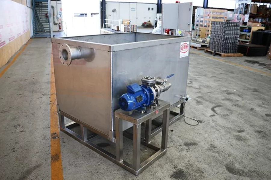 Ebara pump mounted to a stainless steel test rig at the fuel terminal, featuring a control valve and outlet piping in an industrial workshop.