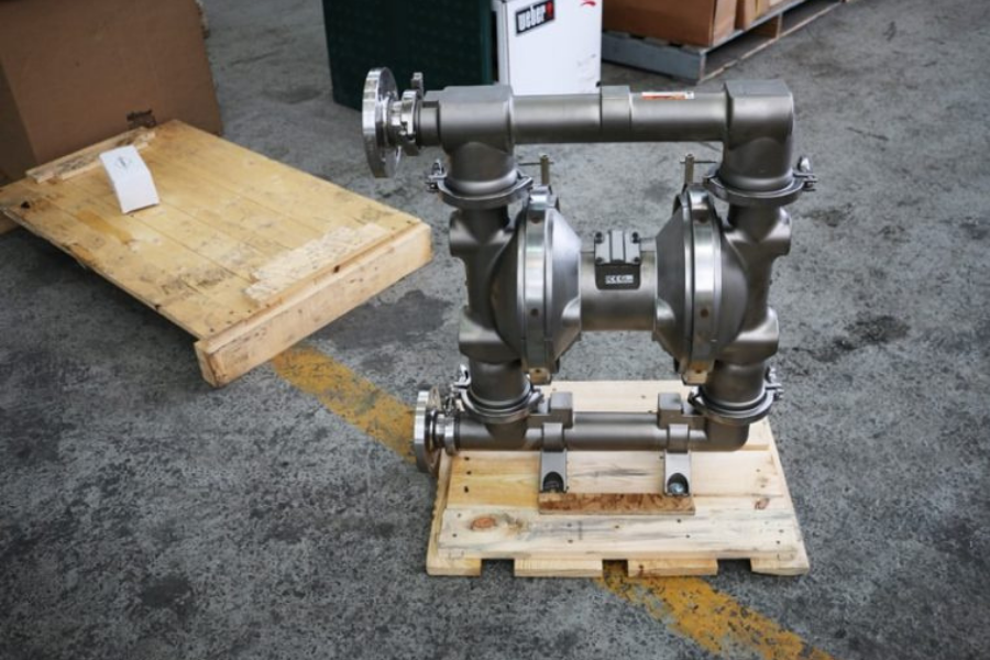 Stainless steel Graco Sanitary Air-Operated Double Diaphragm (AODD) pump, rear view, used for hygienic fluid transfer in food and beverage or pharmaceutical applications