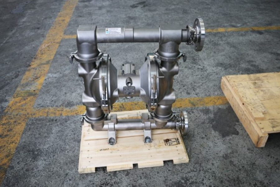 Front view of a robust stainless steel Graco Air-Operated Double Diaphragm (AODD) pump used for medium to high viscosity and corrosive chemical transfer