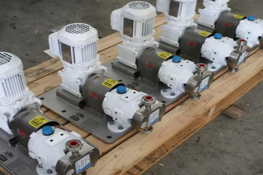Row of hygienic lobe pumps mounted on skids, suitable for sanitary and gentle transfer of viscous products like food ingredients, dairy, and pharmaceuticals