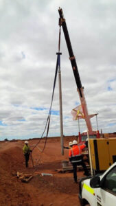 All-pumps technicians and engineers installing a submersible bore pump