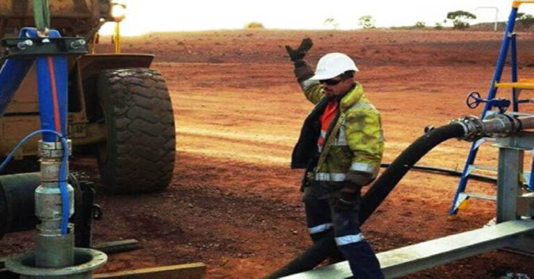 An All-pumps technician installing a borehole pump package