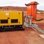 Pump Technicians and engineers installing Bore Pump Package in a mine for dewatering purposes