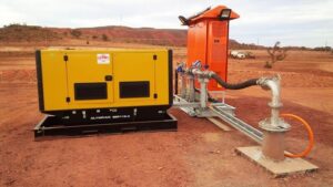 Pump Technicians and engineers installing Bore Pump Package in a mine for dewatering purposes