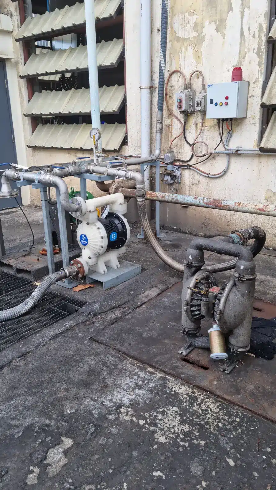 A Graco QUANTM AODD pump displayed on a concrete floor