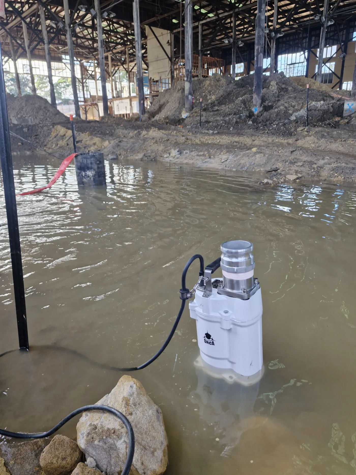 Heavy-duty industrial Orca submersible pump built with high-chrome wear components for abrasive fluid dewatering and high-solids slurry transfer in demanding mining, quarrying, or construction sites.