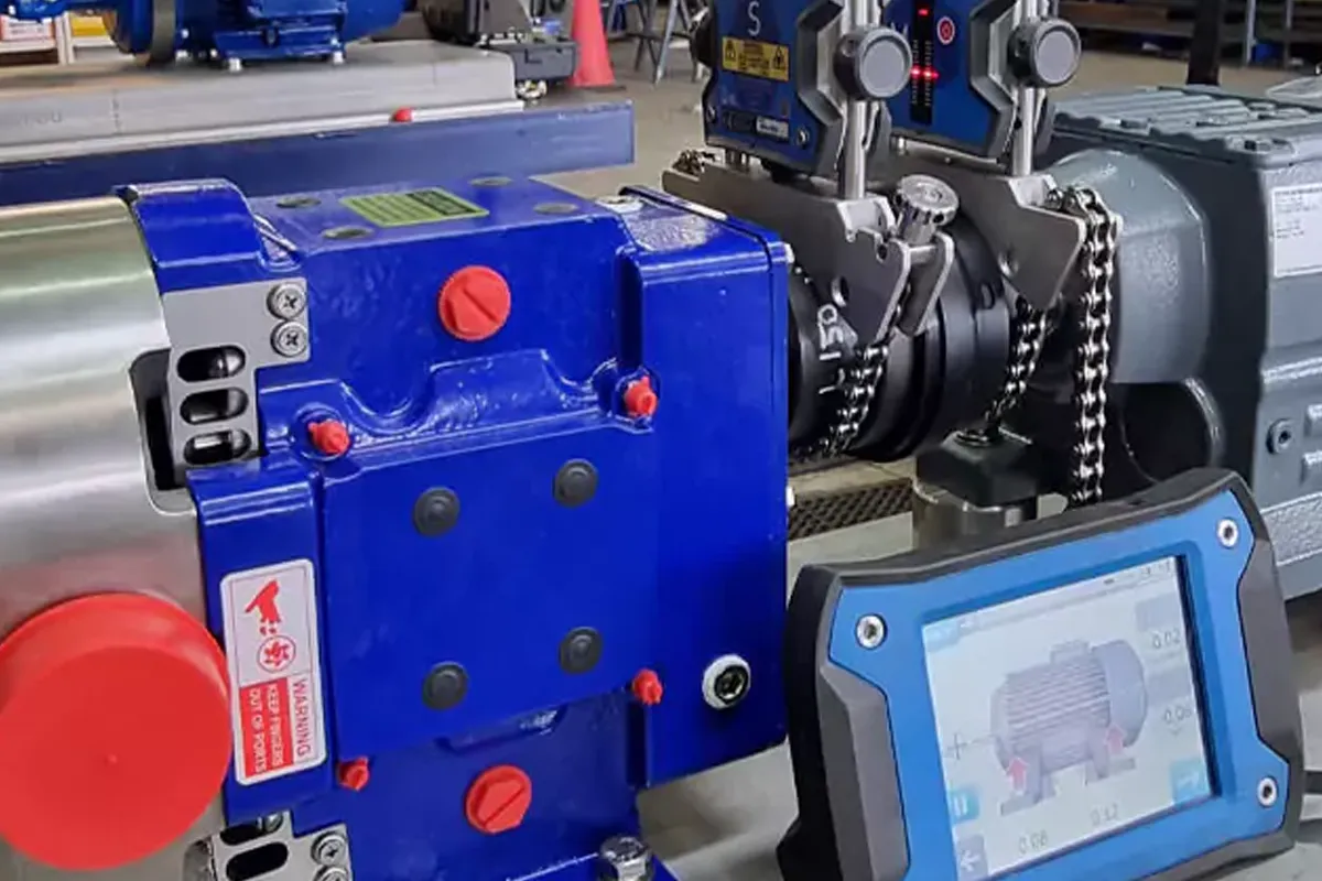 Blue Alfa Laval pump connected to industrial pipework