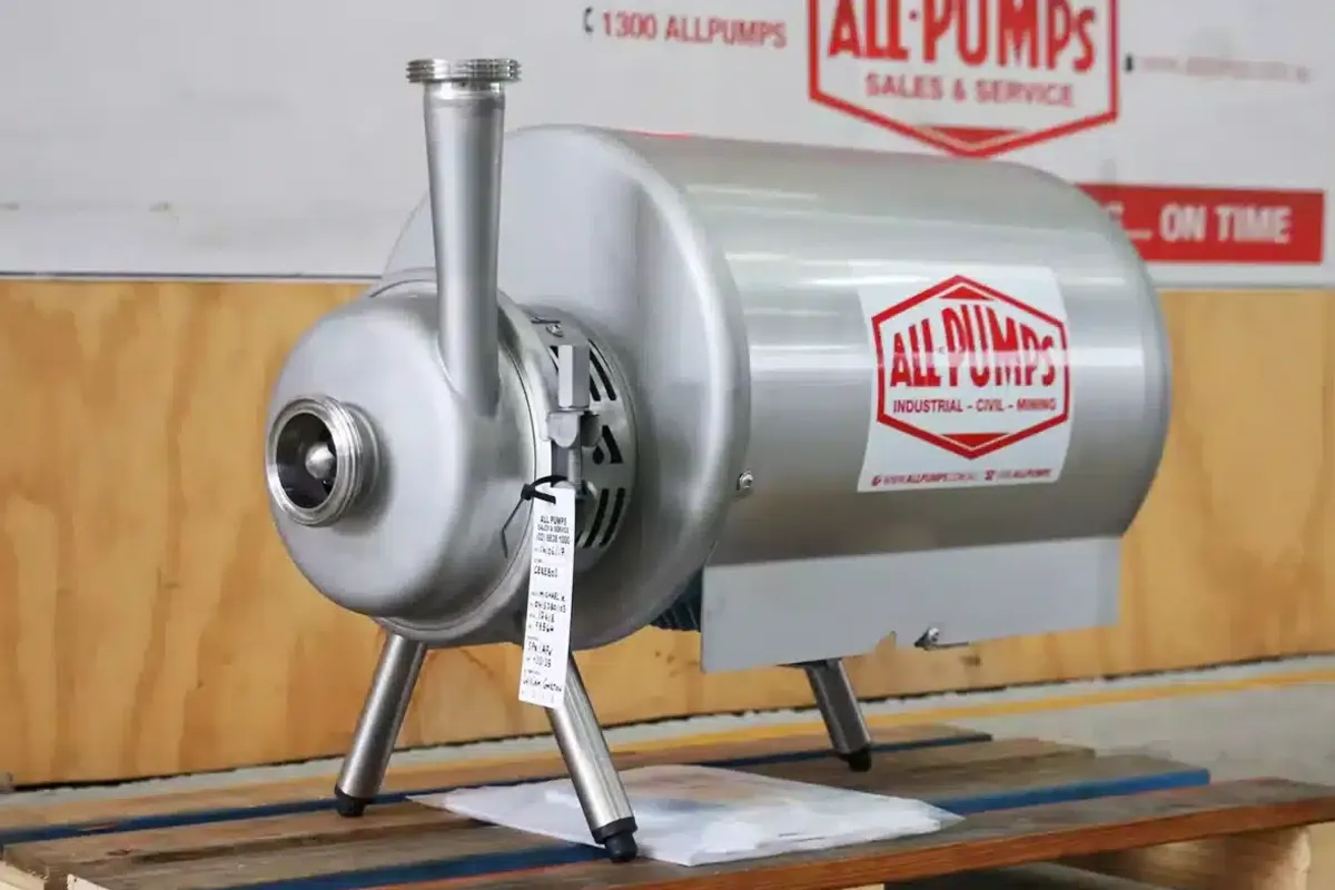 Silver Waukesha Cherry-Burrell pump in front of All Pumps branding