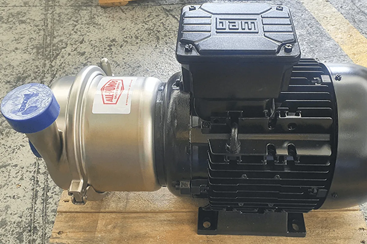 Inoxpa pump and motor assembly photographed in a workshop