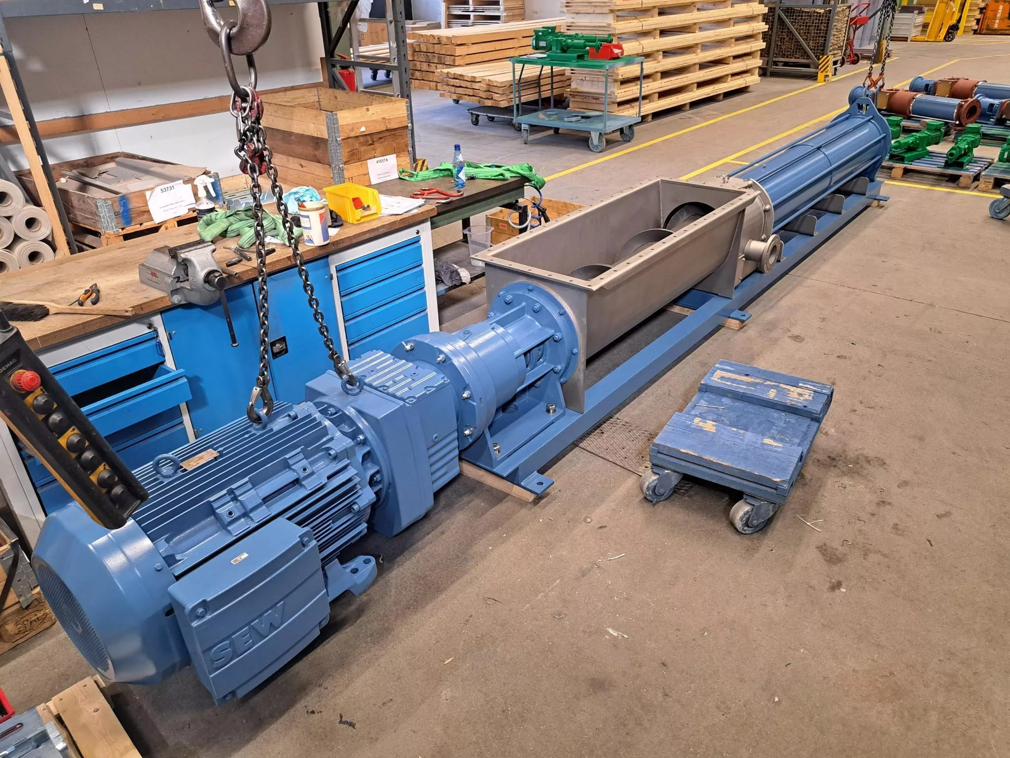 WANGEN progressive cavity pump undergoing workshop maintenance and rebuild with SEW drive assembly for industrial sludge handling applications.