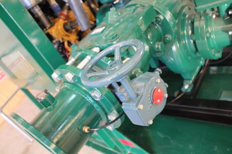 Three green Pioneer Diesel Pump valve and outlet pipe for mine dewatering