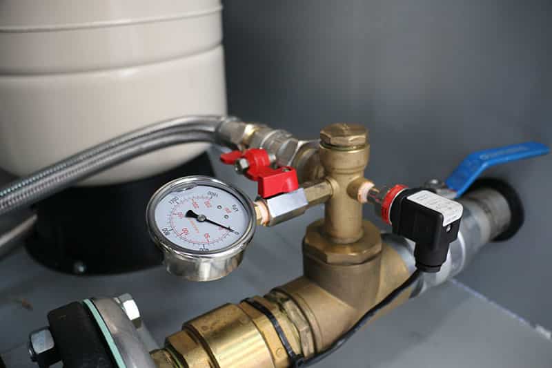 Pressure gauge on a Javelin enclosed skid and valve, ensuring safe and efficient operation.